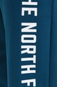 Tepláky The North Face Pant Varsity Graphic tyrkysová NF0A89DP1NO1