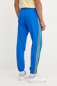 Одяг Спортивні штани adidas Originals IW3234 блакитний