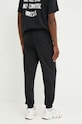Odzież Converse spodnie dresowe 10026982.A01 czarny