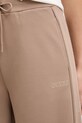 Guess spodnie dresowe OCTAVIA beżowy V5BB12.KCX22