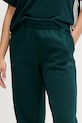 Tepláky adidas Essentials zelená JX0443