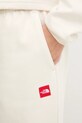 The North Face spodnie dresowe Redbox beżowy NF0A8EG2QLI1