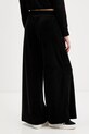 Odzież Juicy Couture spodnie dresowe welurowe JCBBJ225803 czarny
