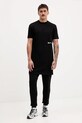 Bombažen spodnji del trenirke Tommy Jeans DM0DM22094 črna AW25