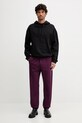 Хлопковые спортивные штаны Versace Jeans Couture 79GAAT07.CF01T фиолетовой AW25