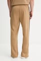 Odzież adidas Originals spodnie dresowe Firebird Tp JY6369 beżowy