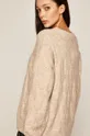 Sweter damski z domieszką wełny beżowy  Materiał zasadniczy: 55 % Akryl, 3 % Elastan, 32 % Poliamid, 10 % Wełna