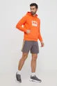 Bombažen pulover Helly Hansen oranžna