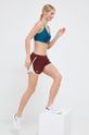 Běžecké šortky Under Armour 1350196 burgundské AW23