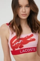 Bikini top Lacoste  Φόδρα: 22% Σπαντέξ, 78% Πολυεστέρας Κύριο υλικό: 23% Σπαντέξ, 77% Πολυεστέρας Άλλα υλικά: 12% Σπαντέξ, 7% Πολυαμίδη, 81% Πολυεστέρας