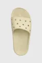 beige Crocs sliders