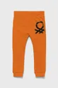 United Colors of Benetton spodnie bawełniane dziecięce pomarańczowy