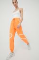 Tréningové nohavice adidas by Stella McCartney Truepace oranžová