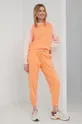 Βαμβακερό παντελόνι New Balance πορτοκαλί