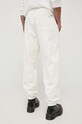 Oblečenie Bavlnené nohavice Tommy Jeans DM0DM12440.PPYY béžová