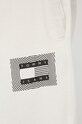 Bavlnené nohavice Tommy Jeans béžová DM0DM12440.PPYY