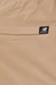 beżowy New Balance spodnie MP13501INC