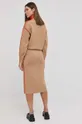 Vunena haljina Victoria Beckham  Temeljni materijal: 1% Elastan, 3% Poliamid, 96% Vuna merinosa Vez: 100% Poliester