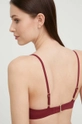 Bikini top Calvin Klein  Κύριο υλικό: 76% Πολυαμίδη, 24% Σπαντέξ Φόδρα: 92% Πολυεστέρας, 8% Σπαντέξ Άλλα υλικά: 100% Πολυεστέρας