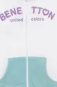 Παιδική βαμβακερή μπλούζα United Colors of Benetton  Κύριο υλικό: 100% Βαμβάκι Πλέξη Λαστιχο: 95% Βαμβάκι, 5% Σπαντέξ
