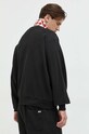 Ruházat Tommy Jeans pamut melegítőfelső DM0DM16376.PPYX fekete