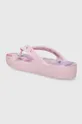 pink Crocs flip flops