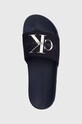 Natikači Calvin Klein Jeans SLIDE MONOGRAM CO mornarsko modra YM0YM00061