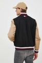 Tommy Hilfiger kurtka bomber x Shawn Mendes Materiał zasadniczy: 68 % Wełna, 26 % Poliamid, 6 % Kaszmir, Podszewka: 100 % Wiskoza, Wstawki: 62 % Bawełna, 38 % Poliamid, Podszewka kieszeni: 100 % Bawełna, Ściągacz: 49 % Akryl, 49 % Wełna, 2 % Elastan