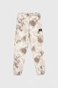 Calvin Klein Jeans spodnie dresowe dziecięce aplikacja beżowy IB0IB01602.PPYX