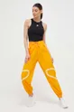 Παντελόνι προπόνησης adidas by Stella McCartney TruePace πορτοκαλί