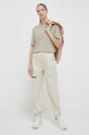 New Balance pantaloni WP31506TWF bej SS23