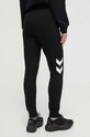 Odzież Hummel spodnie dresowe hmlLEGACY WOMAN TAPERED PANTS 212564 czarny