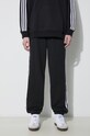 Хлопковые спортивные штаны adidas Originals чёрный IB7457