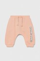 United Colors of Benetton spodnie dresowe bawełniane niemowlęce x Looney Tunes nadruk pomarańczowy 3J68AF012.W.SEASONAL