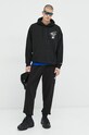 Bavlněné tepláky Tommy Jeans DM0DM15849.PPYX černá SS23