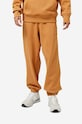 New Balance spodnie dresowe bawełniane bawełna pomarańczowy MP23551TOB
