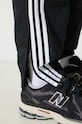 adidas Originals spodnie Adicolor Woven Firebird czarny IT2501
