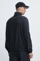 Tréningová bunda Reebok Train Motion Camo 100 % Recyklovaný polyester