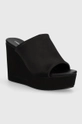 czarny Calvin Klein Jeans klapki WEDGE SANDAL SAT NYL DC Damski