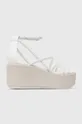 Usnjeni sandali Calvin Klein WEDGE SANDAL 30 LTH Zunanjost: Naravno usnje Notranjost: Naravno usnje Podplat: Sintetični material