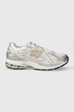 Tenisky New Balance 1906 imitácia kože strieborná M1906RI