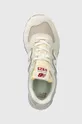 beige New Balance sneakers 574