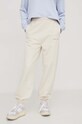 Tommy Jeans spodnie dresowe bawełniane DW0DW17309 beżowy AW24