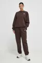 New Balance spodnie dresowe WP33513KCF brązowy