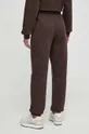 New Balance spodnie dresowe WP33513KCF 60 % Bawełna, 40 % Poliester z recyklingu