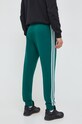 Odzież adidas spodnie dresowe Essentials IN0342 zielony