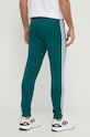 Donji dio trenirke adidas Originals Adicolor Classics SST Track Pants IR9886 zelena SS24