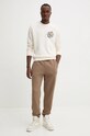 Хлопковые спортивные штаны Herschel 50333.02001 коричневый AW24