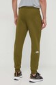 Odzież The North Face spodnie dresowe bawełniane NF0A4SVQPIB1 zielony
