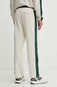 Îmbrăcăminte New Balance pantaloni de trening din bumbac MP41504LIN bej